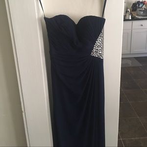 Long blue dress with gem detail on the side